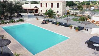 All alone by the pool in Mallorca, she gets actually excited and rubs lube into her moist pussy before shoving the vibrator into her big, juicy hole.