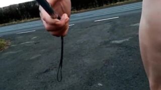 Naked with and without wang pump at side of busy road