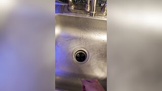 Messy void urine into the kitchen sink