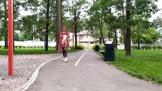 Sluty teen angel walks in the park in a micro costume without panties (upskirt, no panties, stockings)
